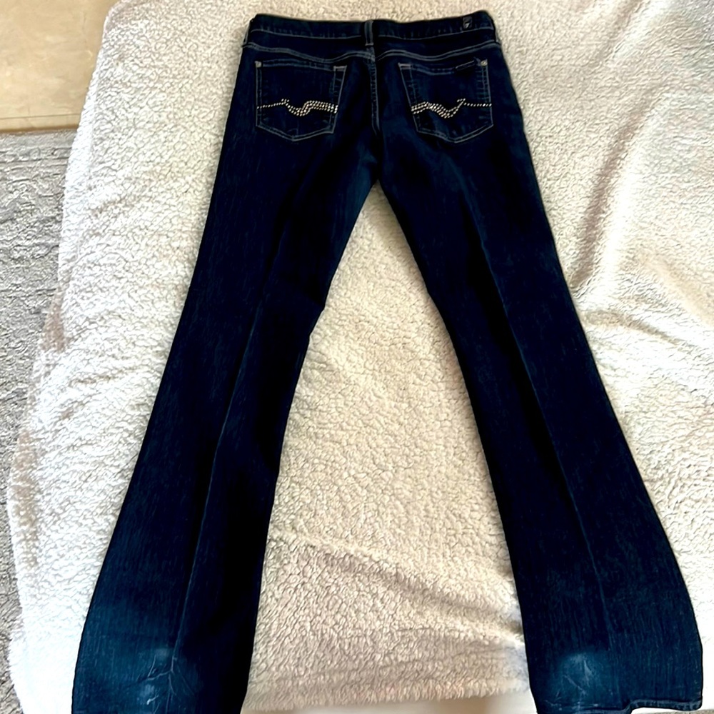 Dark denim 7 jeans with beads and crystals on pocket. It’s a beautiful jean.